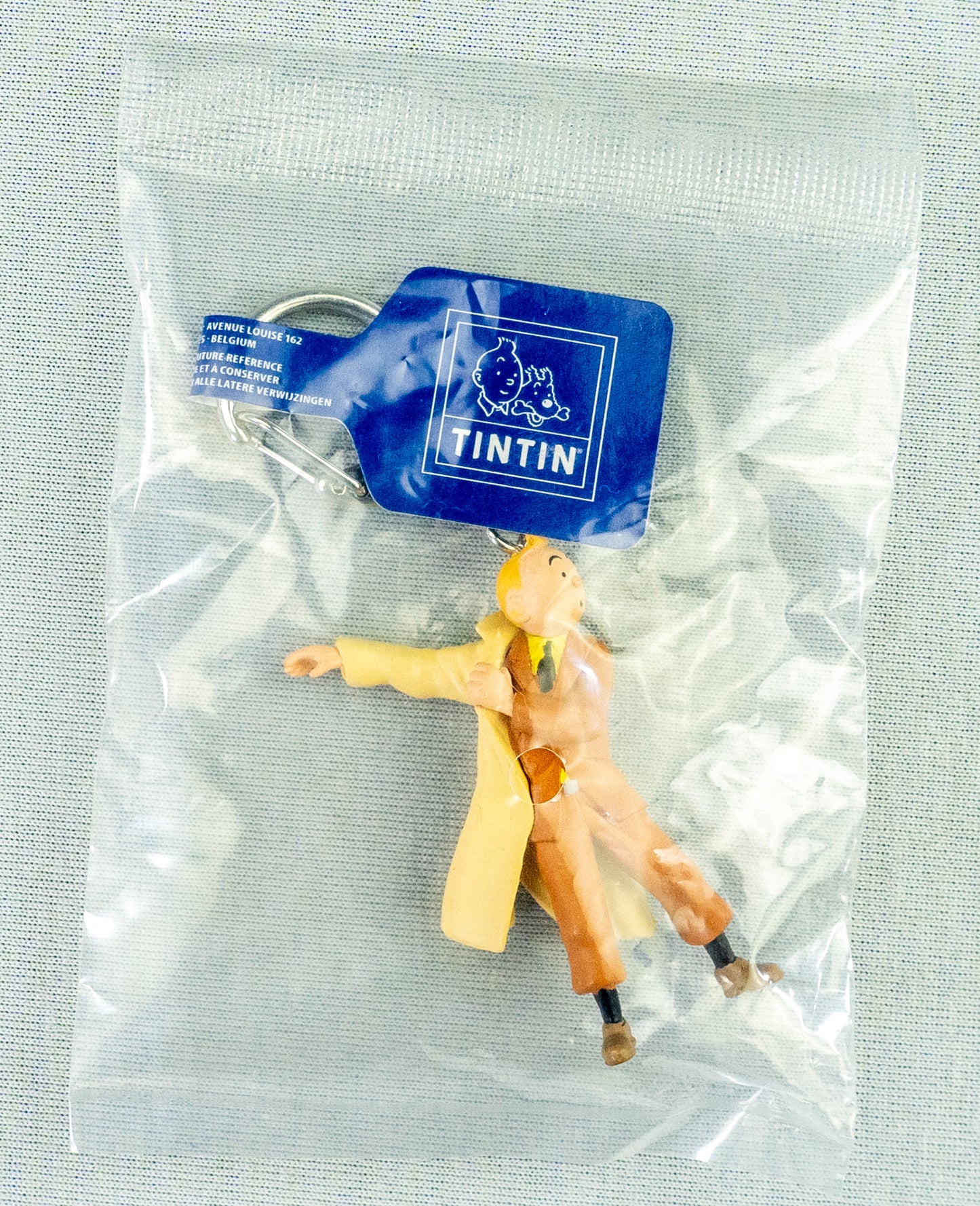 Moulinsart Toy Keyring: Tintin Putting on Coat 42479 5cm Height Official Tintin Figure Key Ring