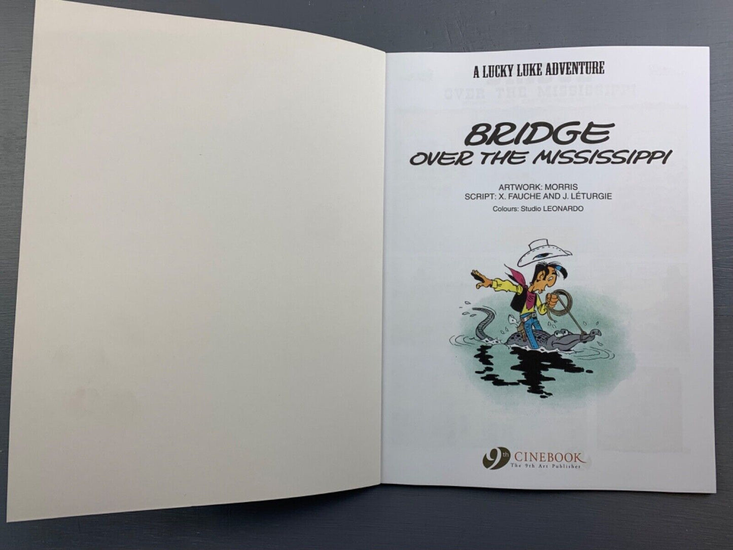 68 Bridge Over Mississippi Lucky Luke Cinebook Paperback UK Comic Book