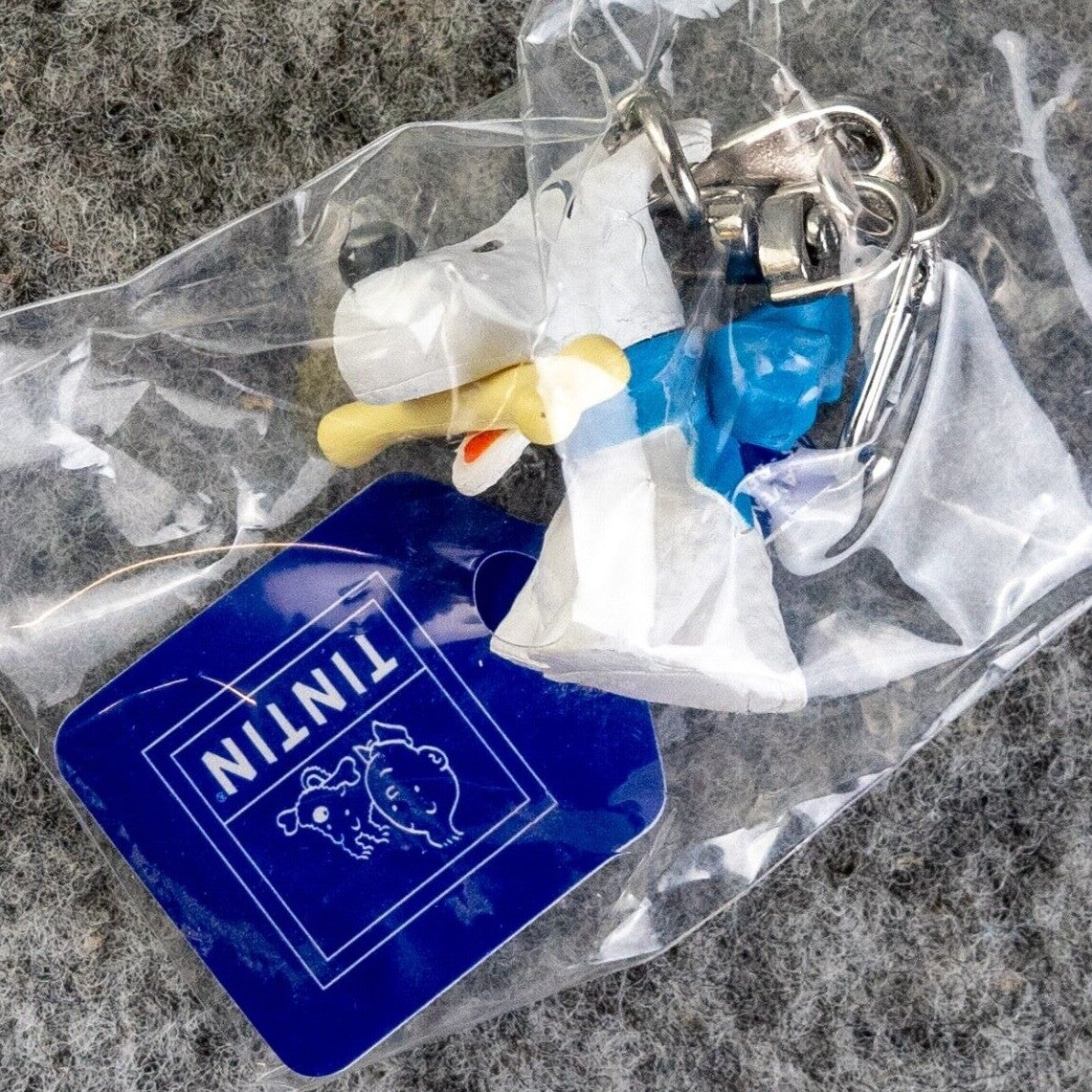 Moulinsart Toy Keyring: Snowy & Bone bust 3.5cm Height 42316 Official Tintin Figure Key Ring