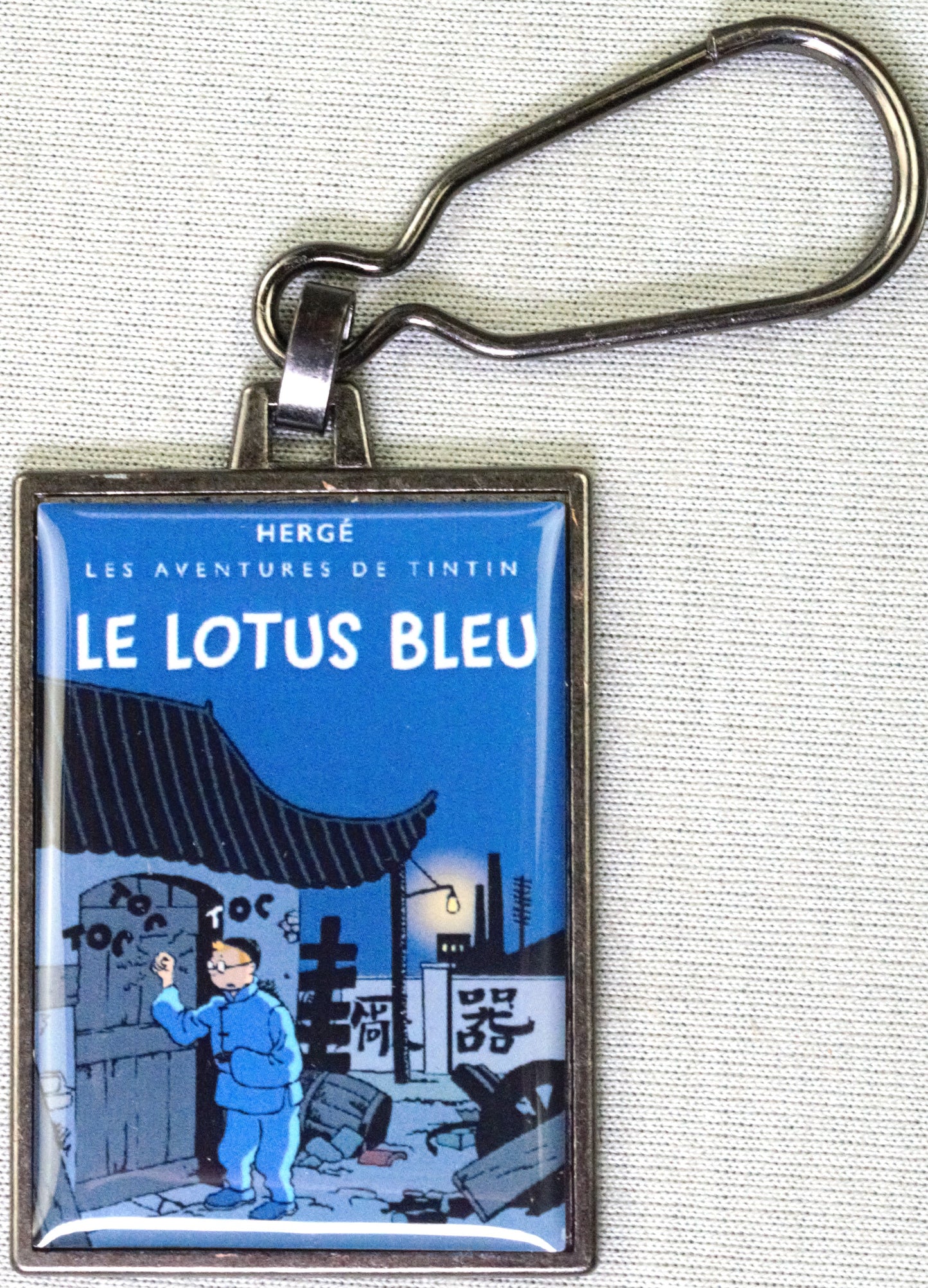 Moulinsart Tintin Title Cover Keyring 42526 -  Le Lotus Bleu Colourised Metal
